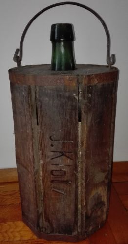 Antique bottle in a wooden case
