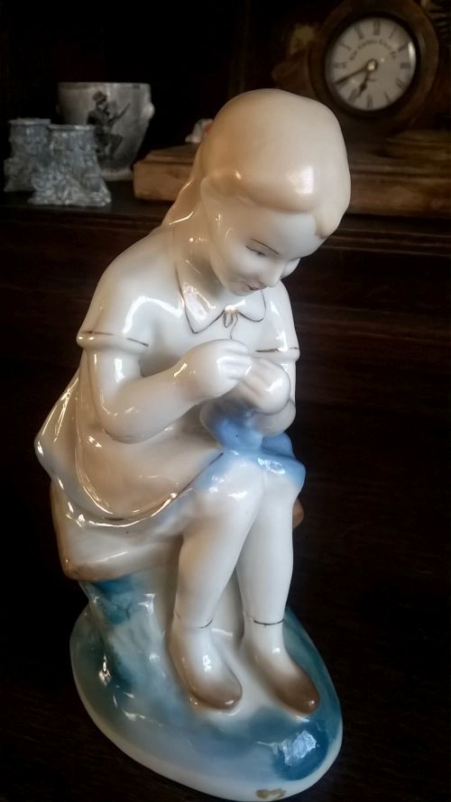 Soviet porcelain figurine of sewing girl