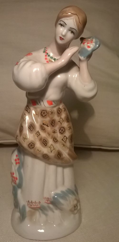 A girl with kalina fruits Soviet Polonne porcelain figurine